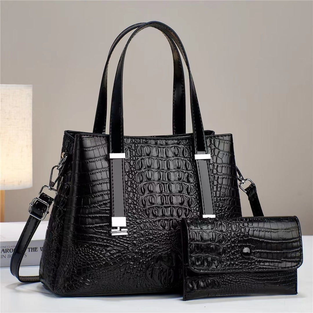 Umhängetasche mit Krokodil-Print und passendem Clutch-Set