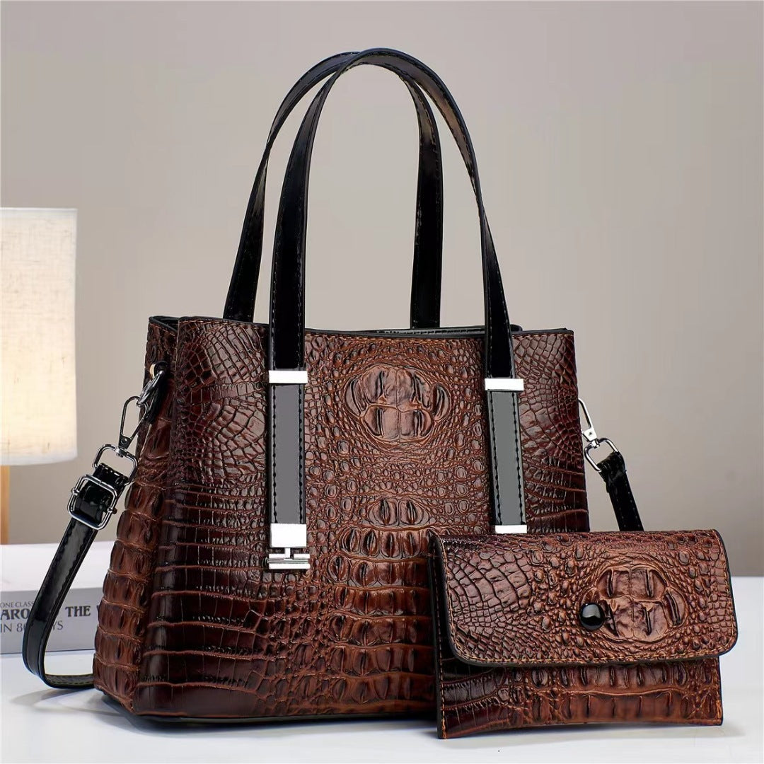 Umhängetasche mit Krokodil-Print und passendem Clutch-Set