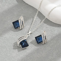 Ensemble collier et boucles d'oreilles en cristal incrusté géométrique