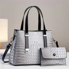 Umhängetasche mit Krokodil-Print und passendem Clutch-Set