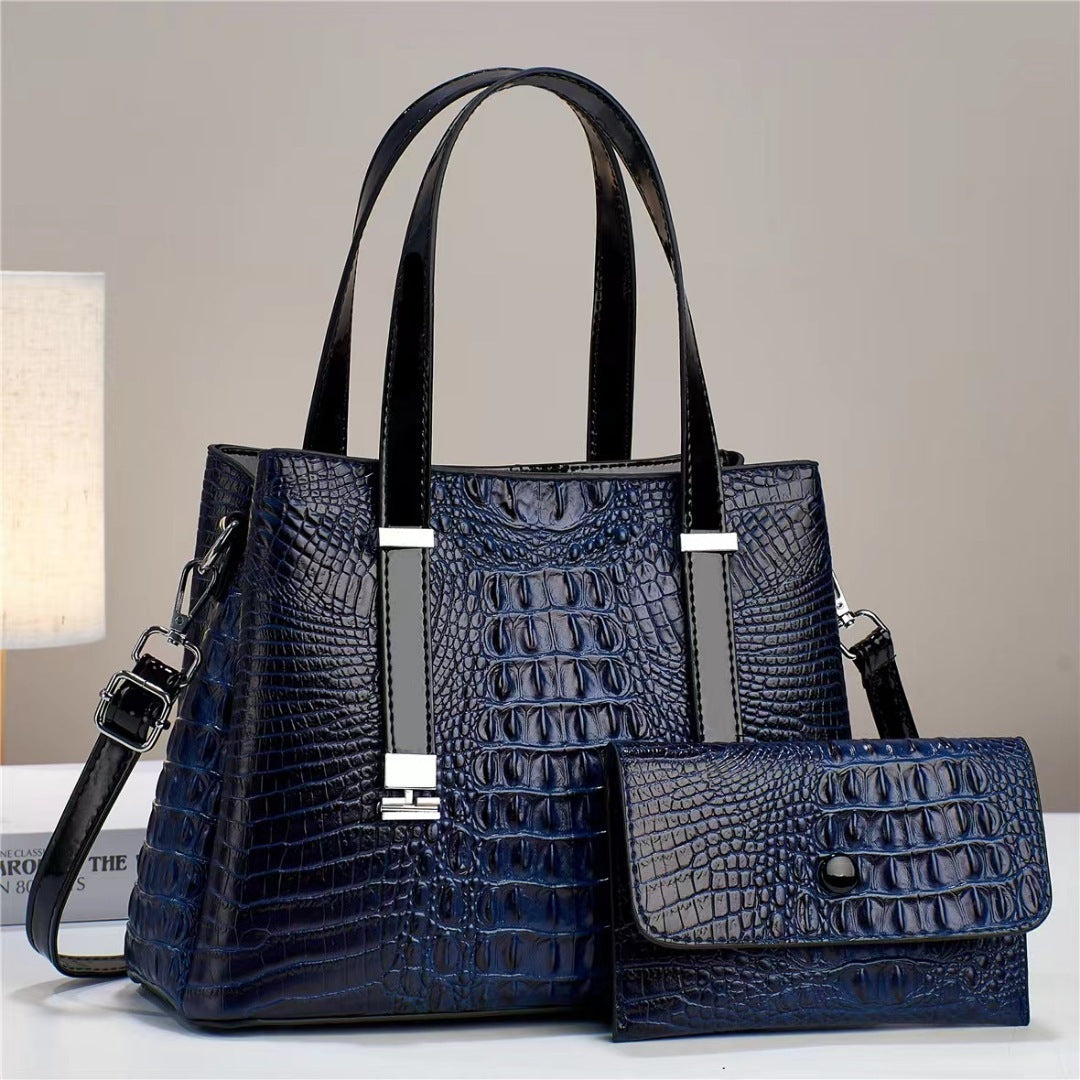 Umhängetasche mit Krokodil-Print und passendem Clutch-Set