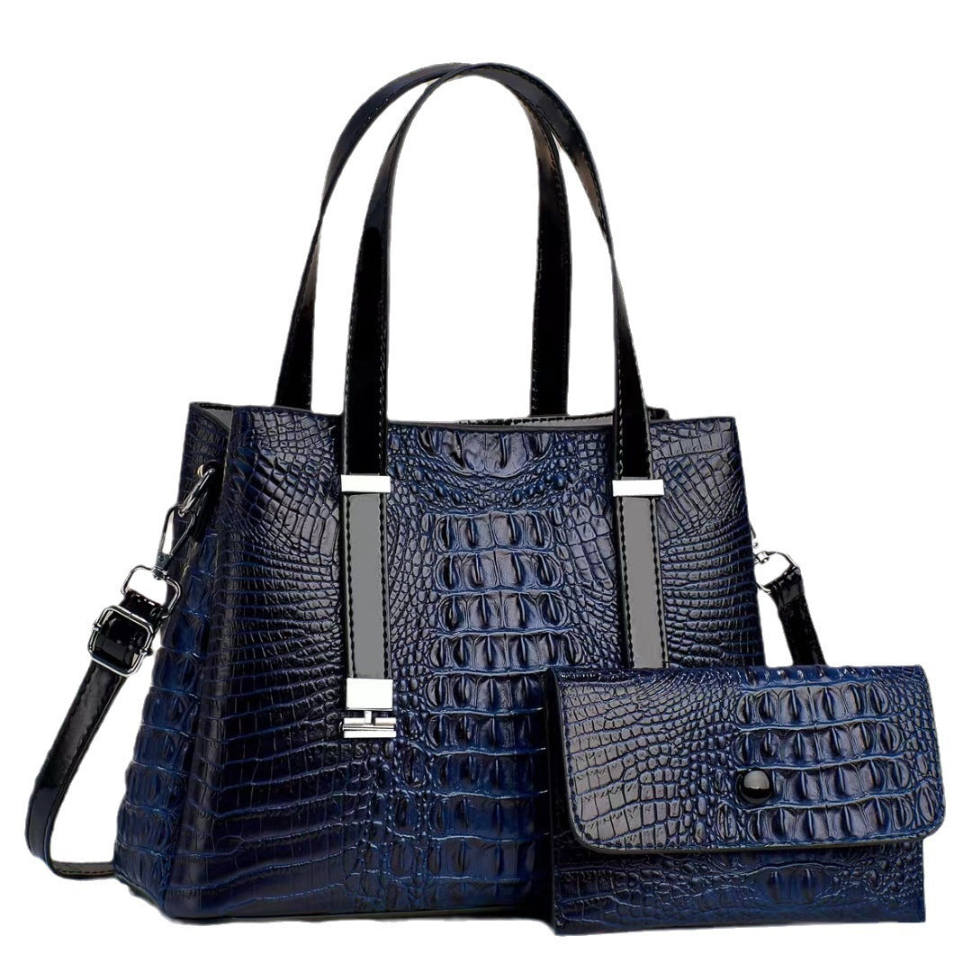 Umhängetasche mit Krokodil-Print und passendem Clutch-Set