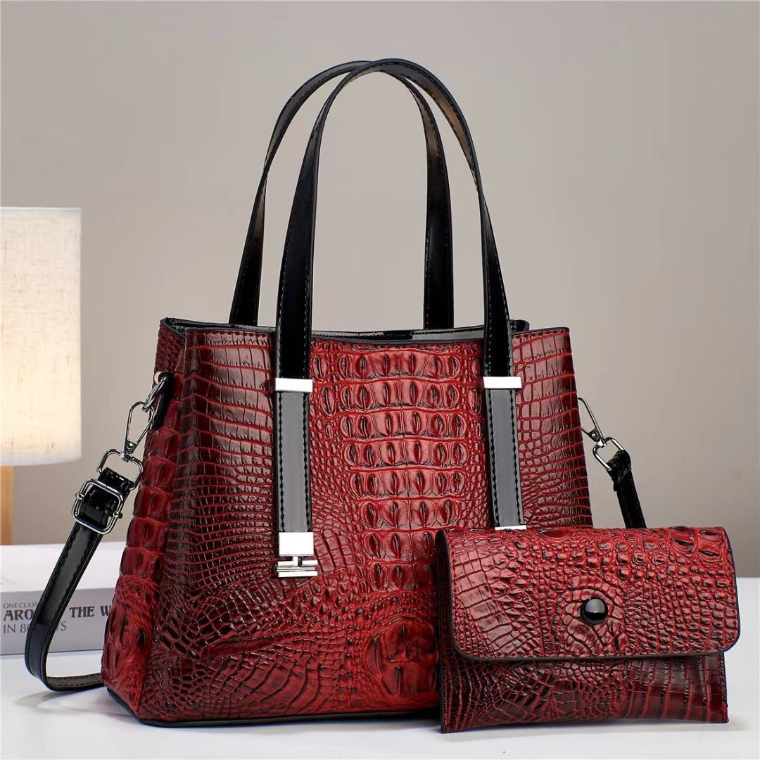 Umhängetasche mit Krokodil-Print und passendem Clutch-Set